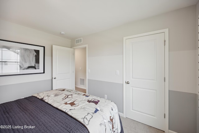 bedroom featuring light carpet