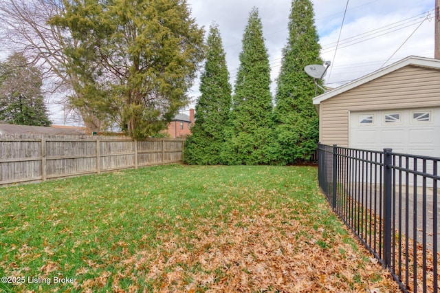 view of yard with a garage and an outdoor structure