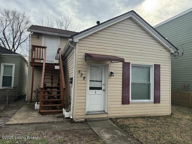 view of front of property with stairway