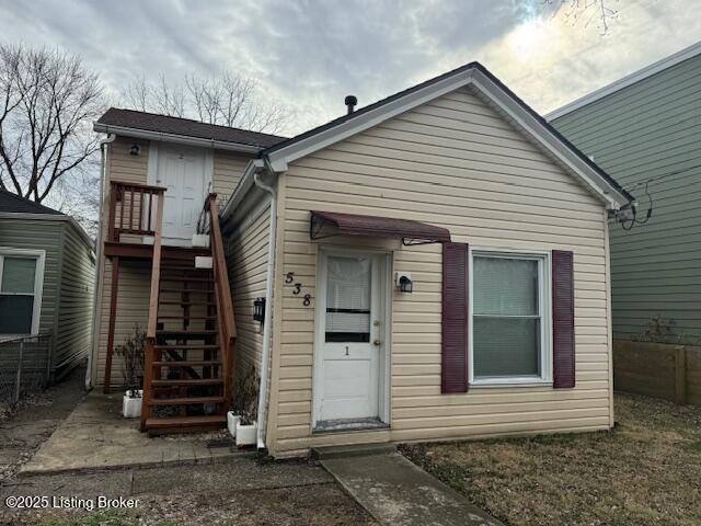 view of front of property with stairway