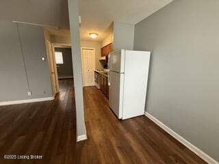 kitchen with dark wood-type flooring and white fridge