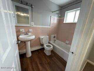 bathroom with wood-type flooring, shower / bathing tub combination, and toilet