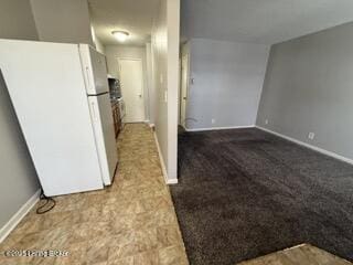 kitchen featuring white fridge