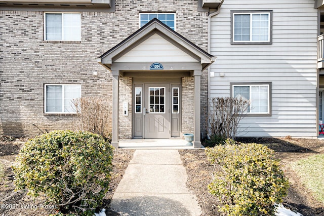 entrance to property with brick siding