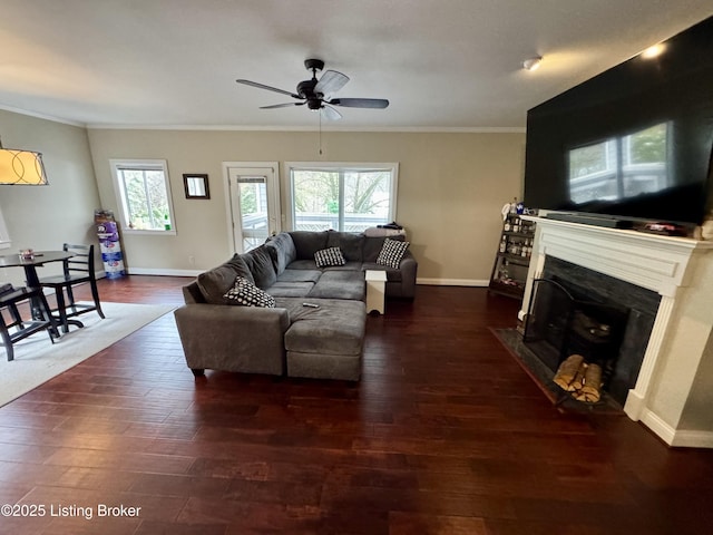 living room featuring ornamental molding, dark hardwood / wood-style floors, and ceiling fan