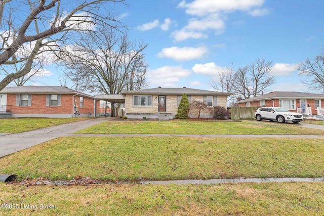 view of front of home with a carport and a front lawn