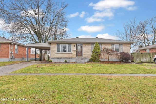 view of front of home with a front yard and a carport