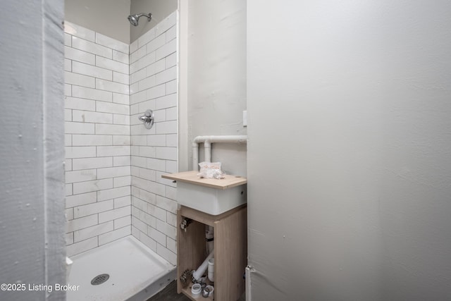 bathroom with a tile shower