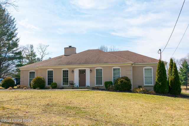 single story home with a front yard