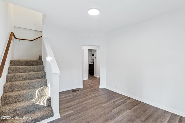 4145 W Muhammad Ali Blvd, Louisville, KY 40212 - staircase featuring hardwood / wood-style floors