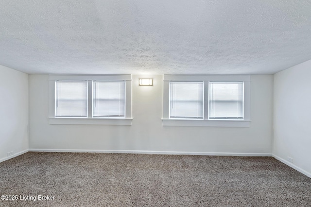 4145 W Muhammad Ali Blvd, Louisville, KY 40212 - spare room with a healthy amount of sunlight, carpet flooring, and a textured ceiling