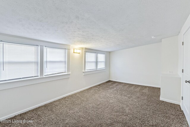 4145 W Muhammad Ali Blvd, Louisville, KY 40212 - spare room featuring carpet flooring and a textured ceiling