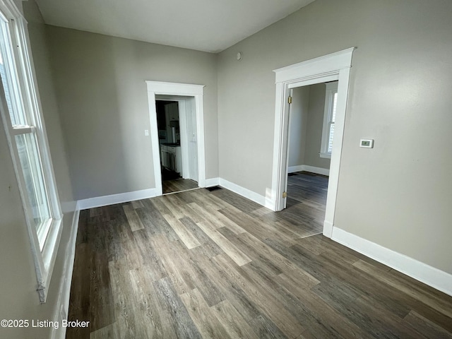 unfurnished room featuring hardwood / wood-style flooring