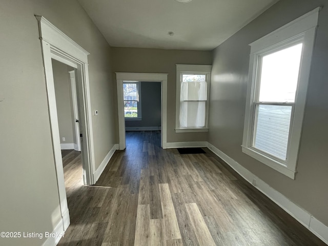 interior space with dark hardwood / wood-style flooring