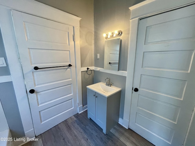 bathroom with vanity and hardwood / wood-style floors