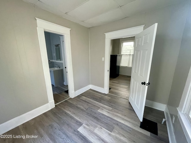 corridor with wood-type flooring