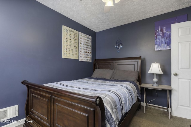 bedroom with baseboards, visible vents, ceiling fan, a textured ceiling, and dark carpet