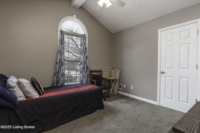 carpeted bedroom with vaulted ceiling with beams, a textured ceiling, baseboards, and ceiling fan