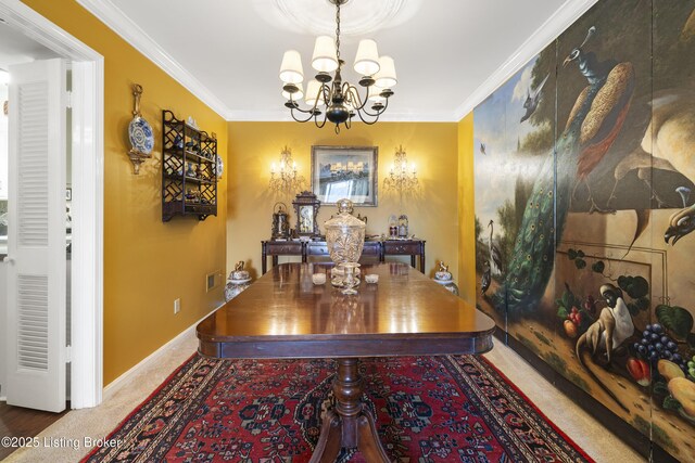 dining area with carpet floors, ornamental molding, and a chandelier