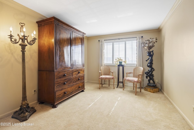 living area with crown molding and light colored carpet