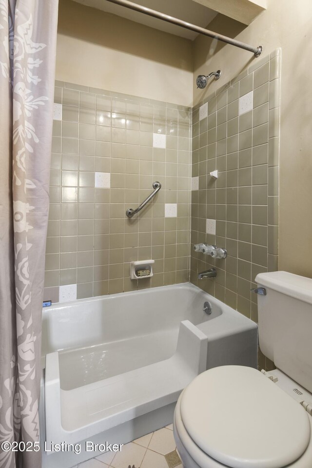 bathroom with shower / bath combination with curtain, tile patterned floors, and toilet