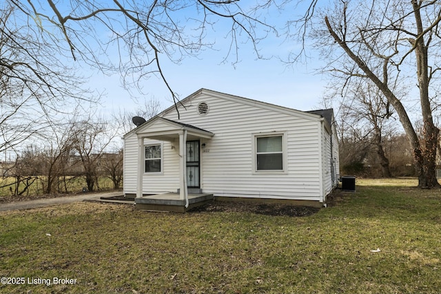 view of front facade with a front lawn and central AC unit