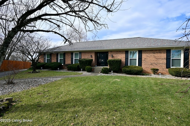 single story home featuring a front yard