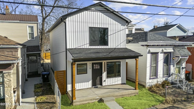 view of front of home featuring roof with shingles and board and batten siding