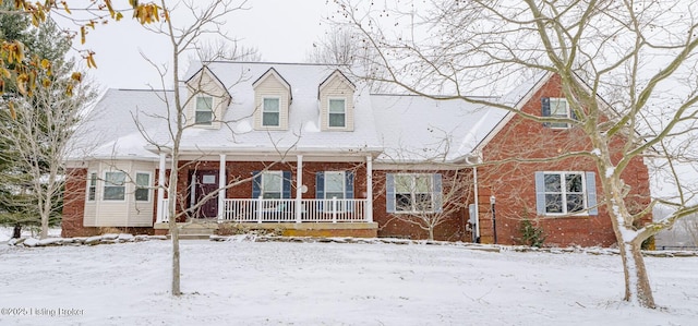 new england style home featuring a porch