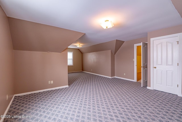 bonus room with carpet floors and lofted ceiling