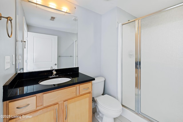 full bathroom featuring visible vents, a shower stall, toilet, and vanity