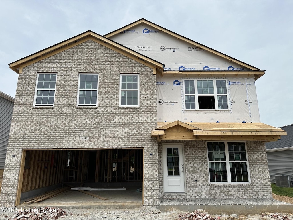 12008 Parkview Trace Dr, Louisville, KY 40229 - view of front of home with a garage, brick siding, and central AC unit
