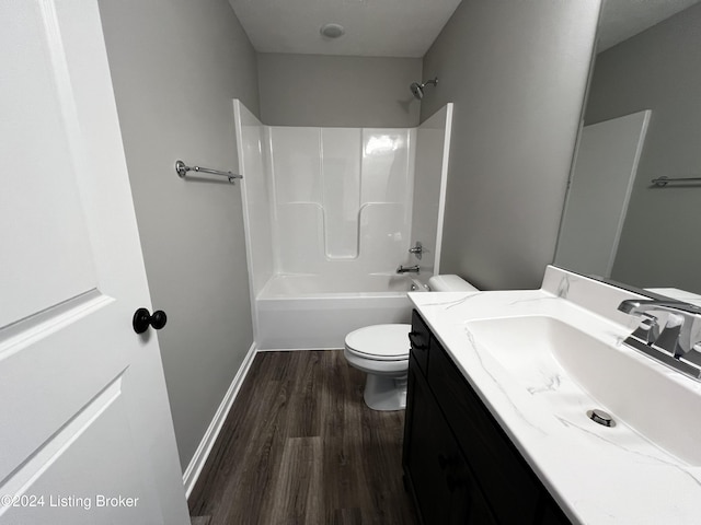 full bathroom featuring vanity, wood-type flooring, toilet, and shower / bath combination