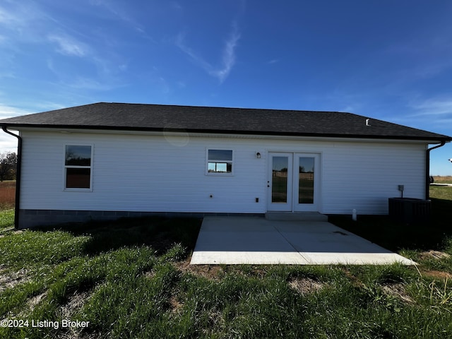 back of house with a patio area, french doors, and central air condition unit