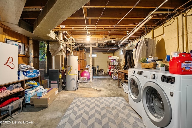 basement featuring gas water heater and washer and dryer