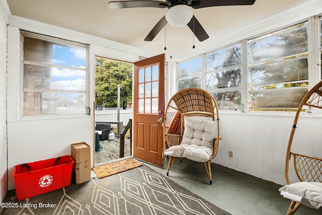 sunroom featuring ceiling fan