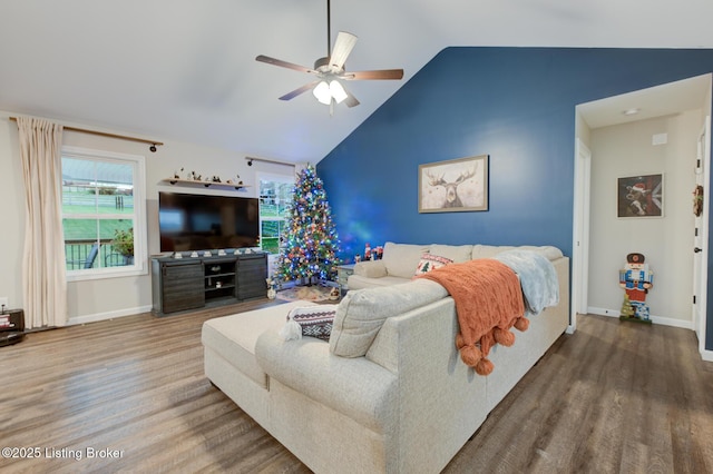 bedroom featuring ceiling fan, lofted ceiling, and hardwood / wood-style floors