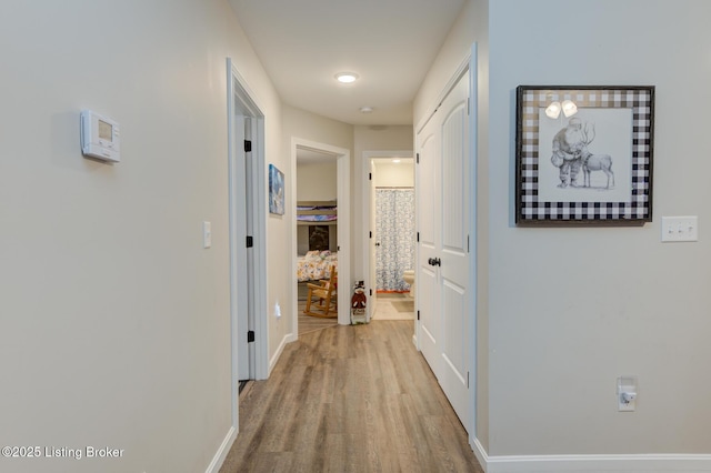 hallway featuring light hardwood / wood-style flooring