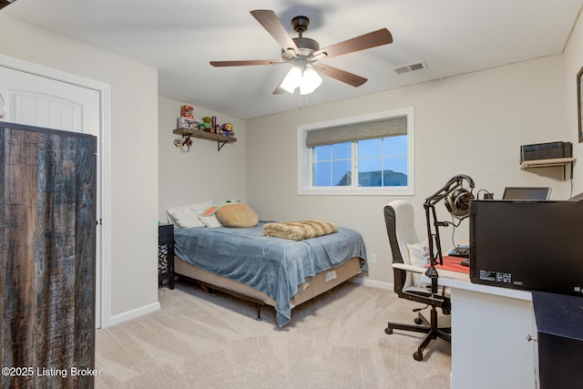 bedroom with light carpet and ceiling fan