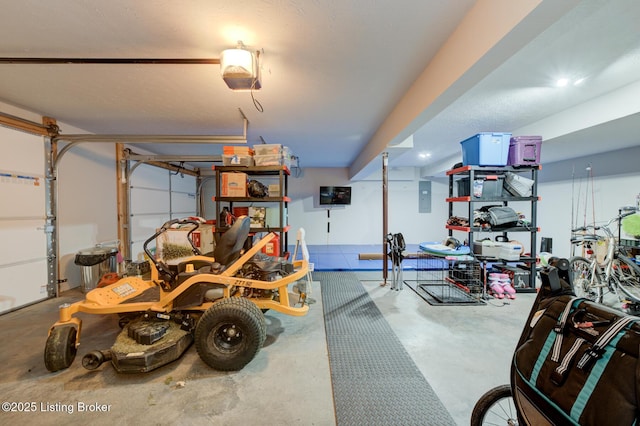 garage featuring a garage door opener and electric panel