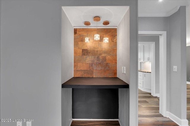 interior space featuring hardwood / wood-style flooring and tasteful backsplash