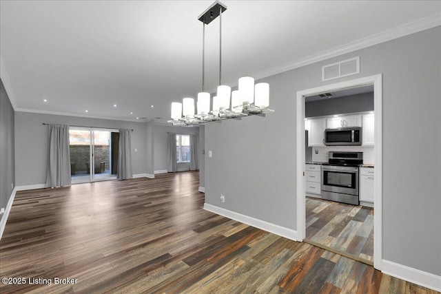 unfurnished dining area with ornamental molding, a notable chandelier, and dark hardwood / wood-style flooring