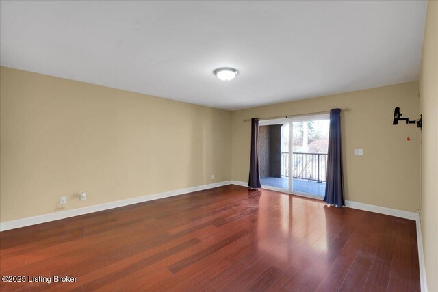 empty room with hardwood / wood-style flooring