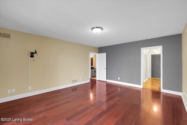 empty room with wood-type flooring