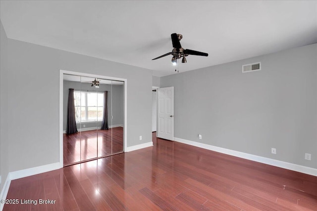 spare room featuring hardwood / wood-style flooring and ceiling fan