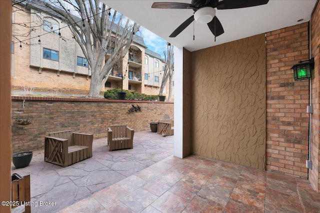 view of patio / terrace featuring ceiling fan