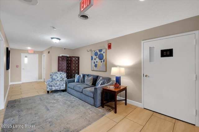 living room featuring a textured ceiling