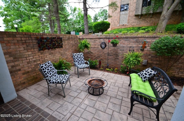 view of patio / terrace with an outdoor fire pit