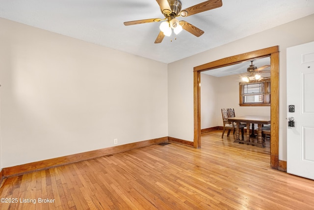 spare room with ceiling fan and light hardwood / wood-style floors