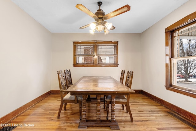 dining room featuring ceiling fan and light hardwood / wood-style flooring